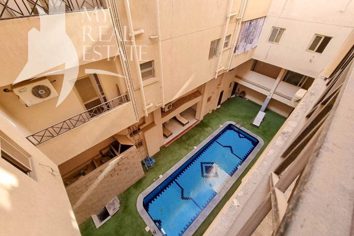 Yard of an apartment building with a swimming pool in Egypt