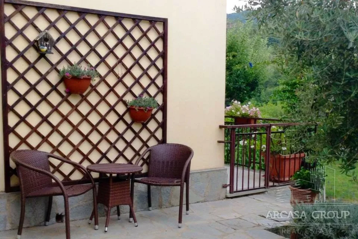 table and chairs outside the house