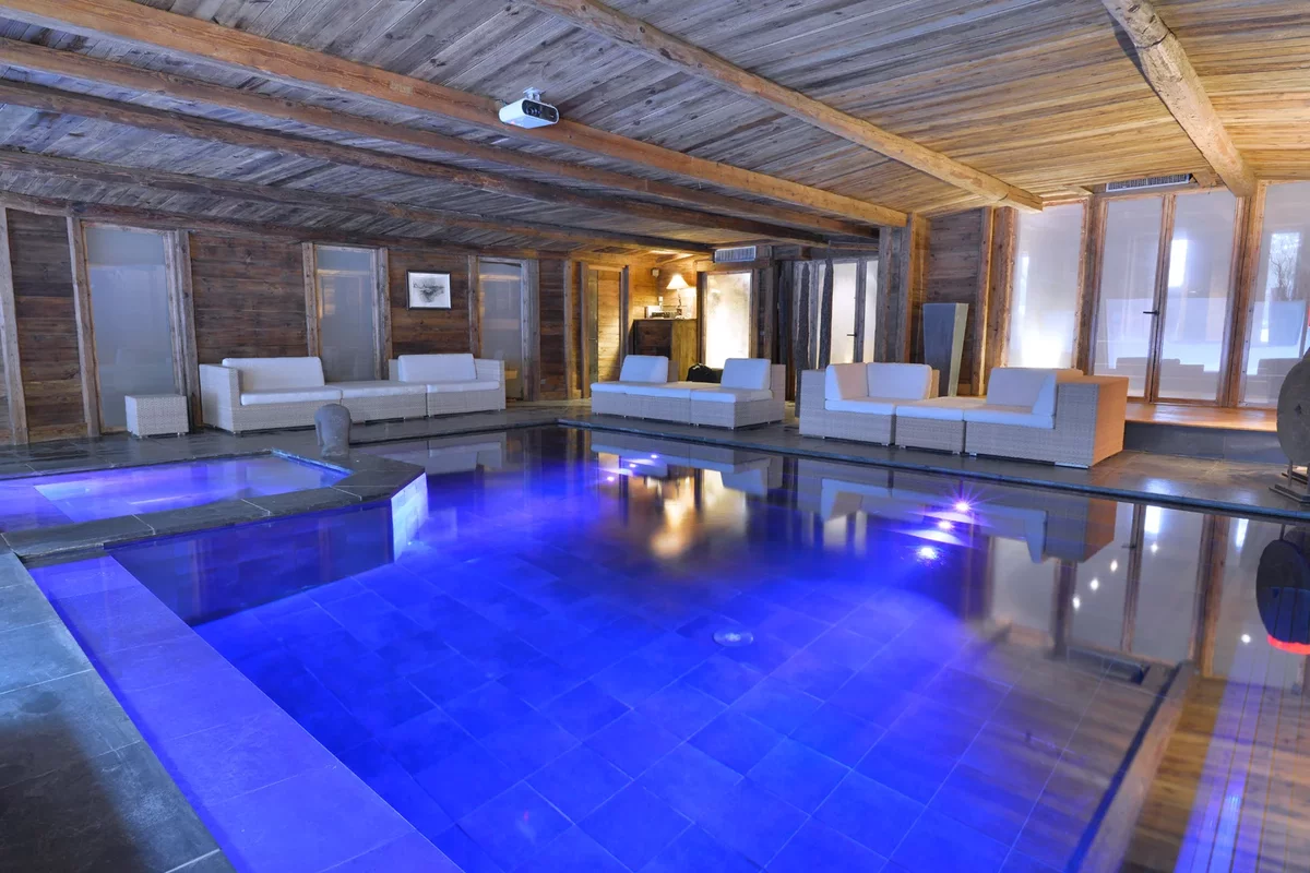 A swimming pool inside a large house in France