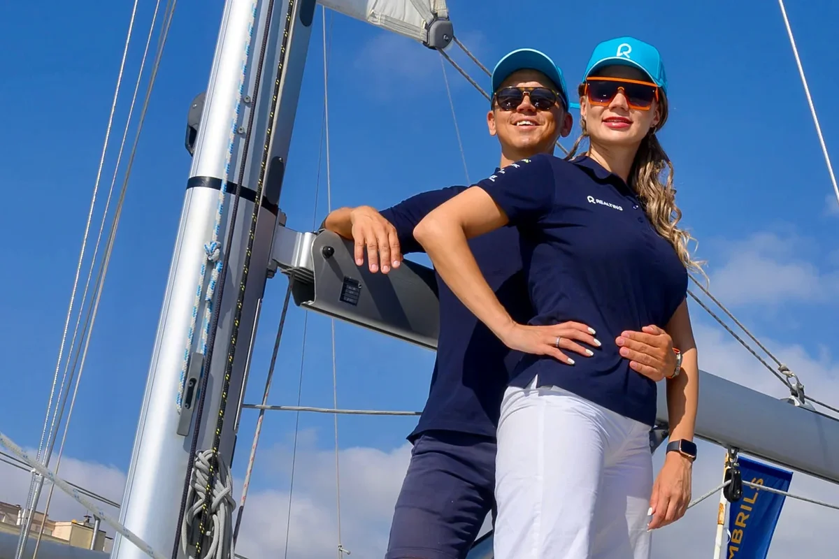 smiling man and woman on a yacht