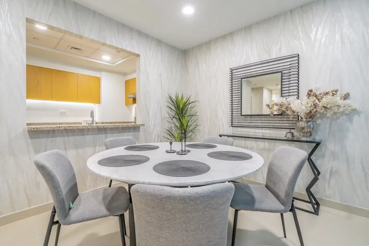 Gray table and chairs in the kitchen of an apartment in a residential building in Dubai