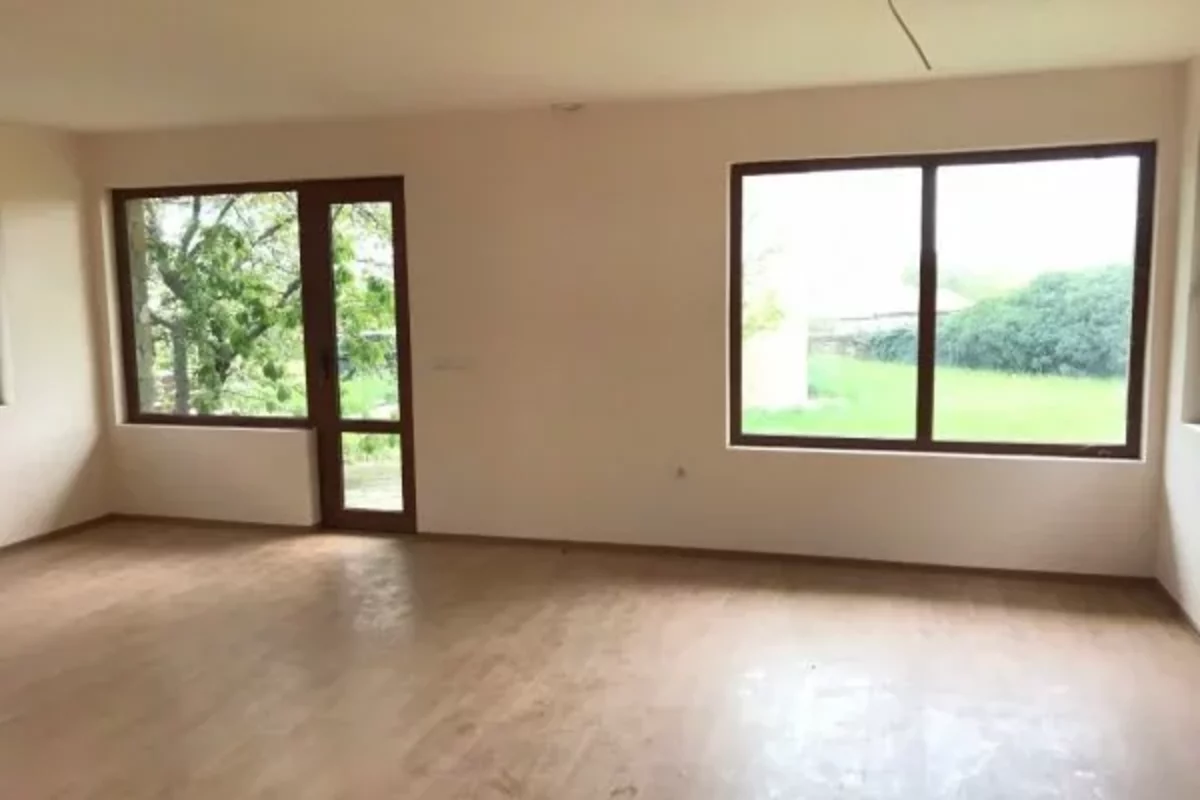 Beige living room walls without furniture in a cottage in Bulgaria