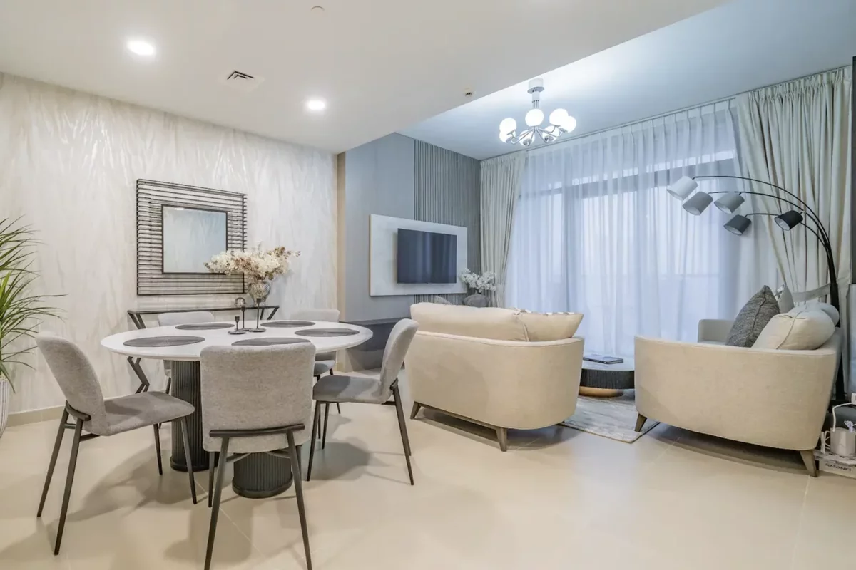 Light sofa and dining table with chairs in an apartment in Dubai
