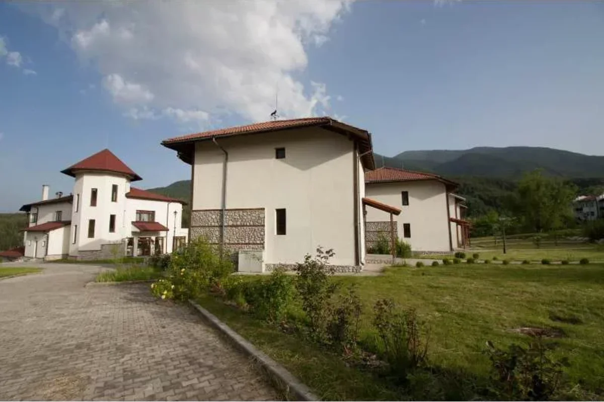 cottage with mountains in the background, Bulgaria