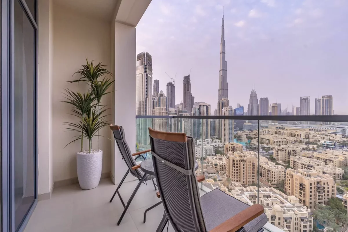 Chairs on a balcony overlooking the city of Dubai