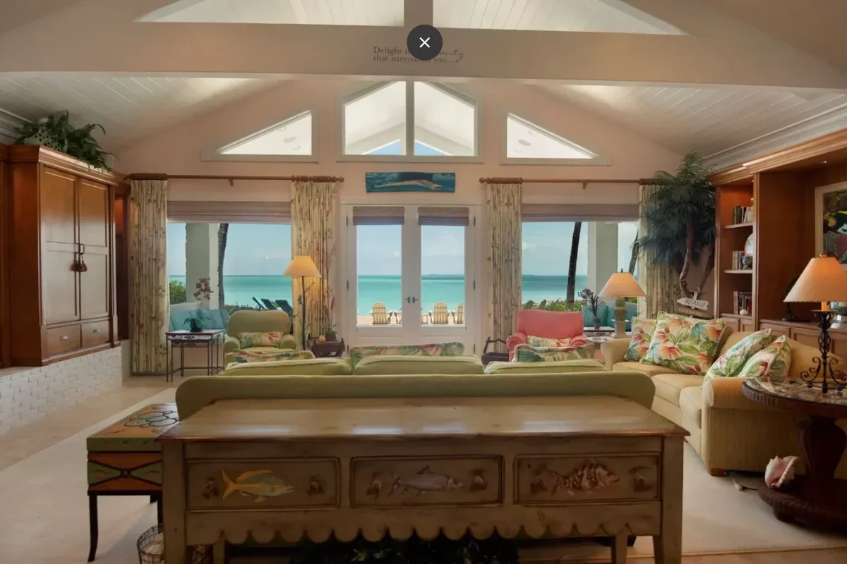 Panoramic windows in the living room of a villa in the Bahamas overlooking the Abaco Sea