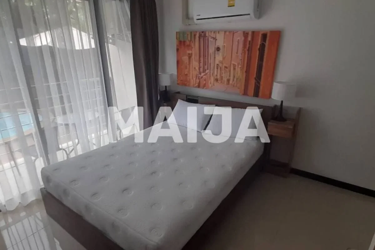 a bedroom in a flat in Thalang