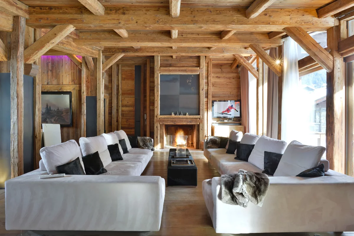 Huge light sofas and fireplace in a house in France