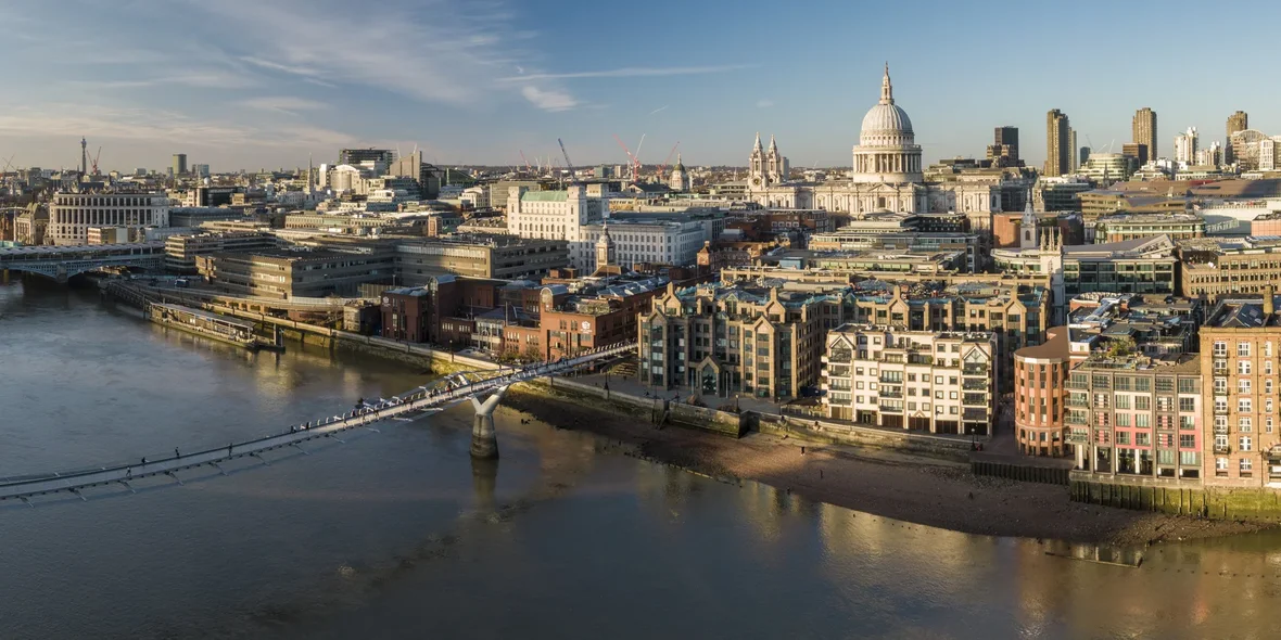 United Kingdom, London, aerial view of the Millennium Bridge over the Thames at sunset