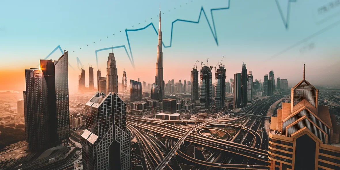 An aerial view of skyscrapers and roads in Dubai at sunset