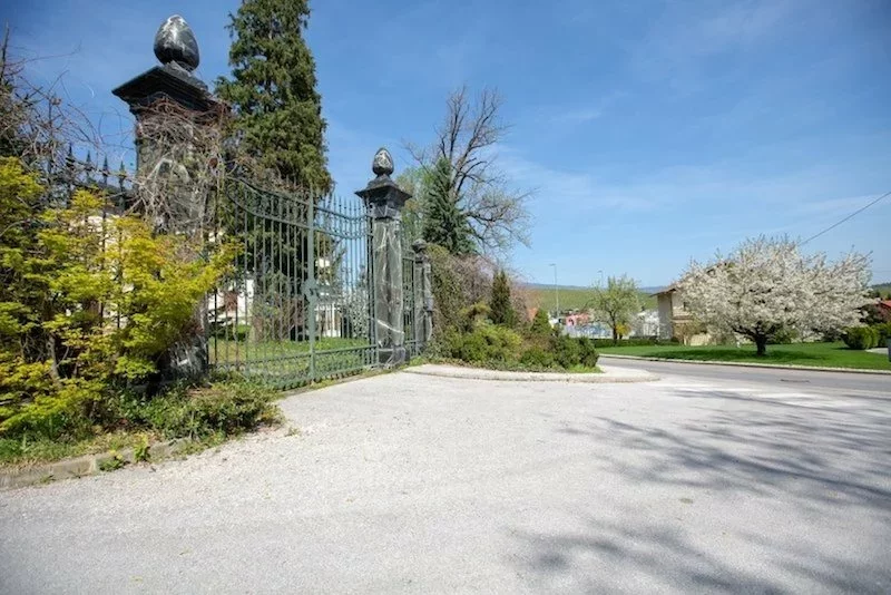 The gate at the main entrance to the castle grounds in Slovenia