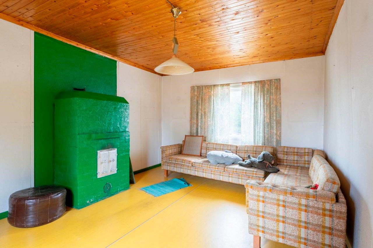 sofa and bright green stove in the living room