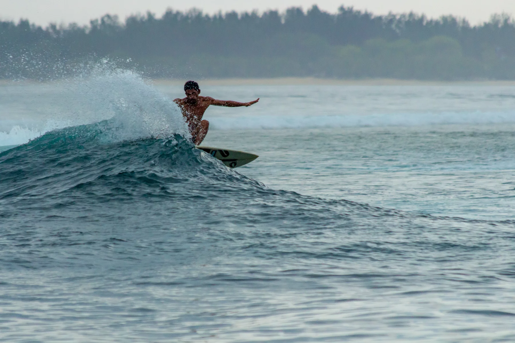 surfing on the island Lombok in Indonesia