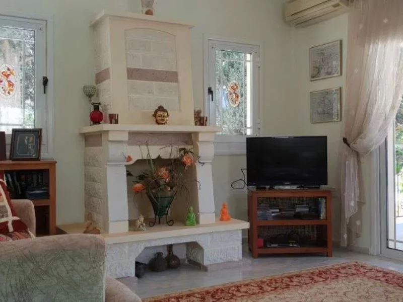 a fireplace in the living room of a house in north cyprus