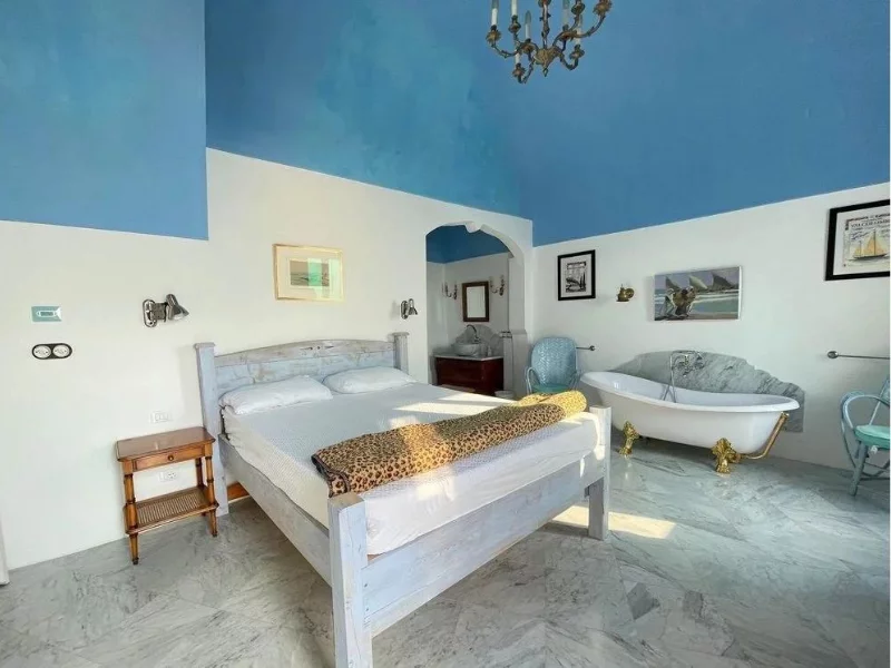 wooden bed in a sralna in a villa in Liguria