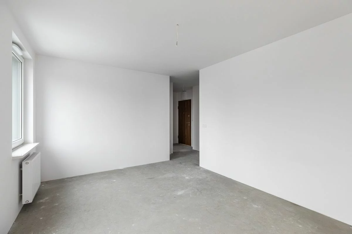 an unfurnished living room in a flat in Poland