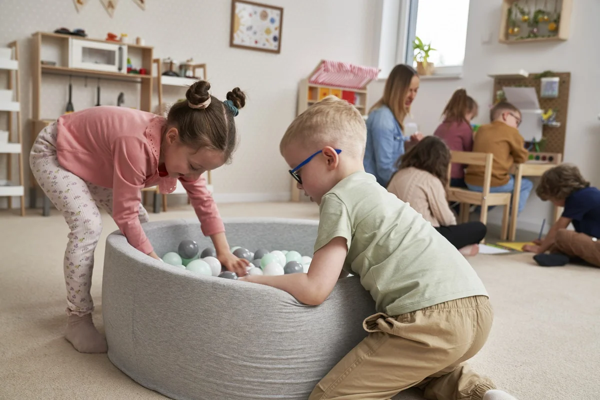 Children play together in kindergarten