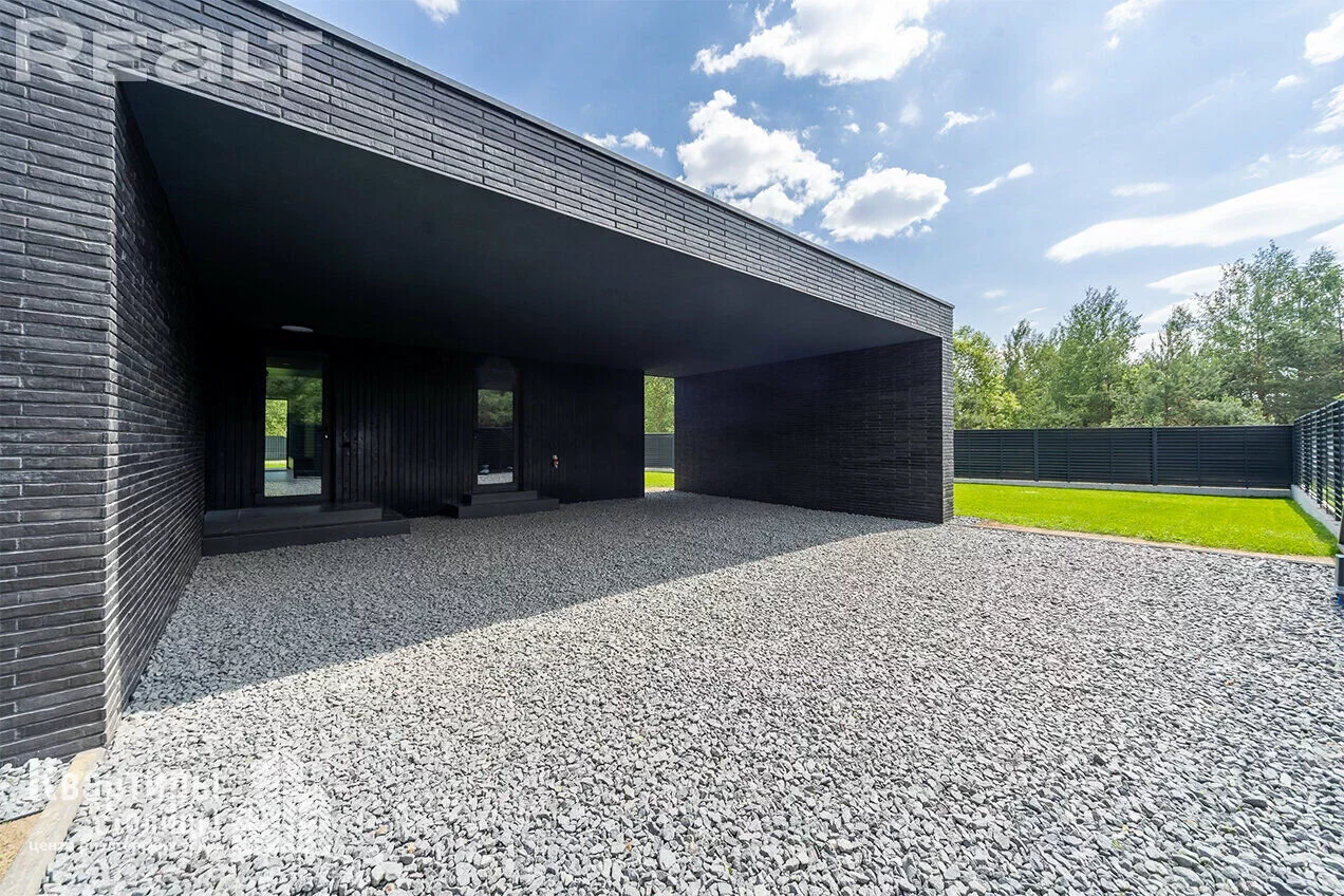 Garage on the territory of a modern house in Belarus