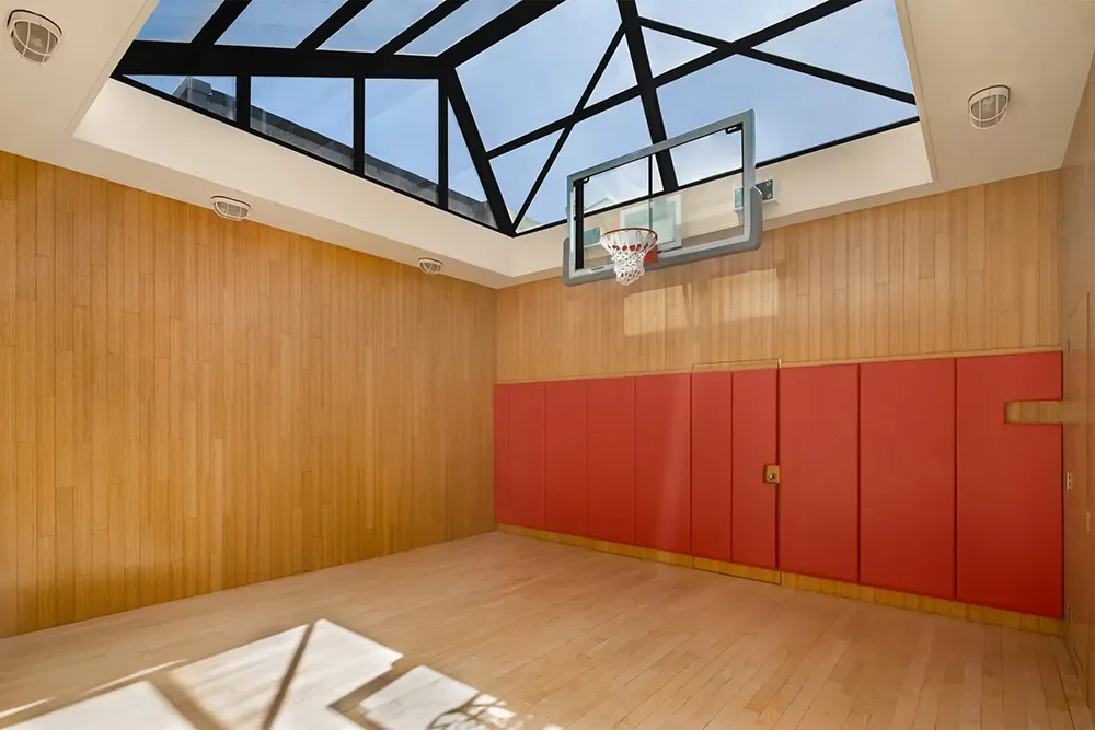 a basketball court right in the mansion
