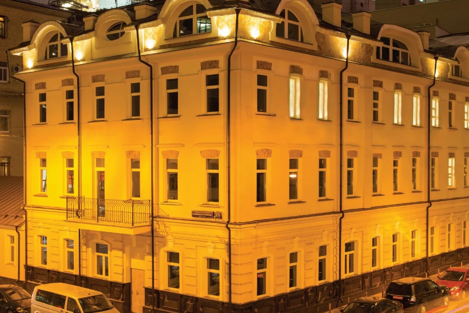The façade of a house in Moscow at night lighting
