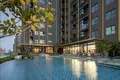 Kompleks mieszkalny High-rise residence with a swimming pool and lounge areas in a posh neighborhood of Bangkok, Thailand