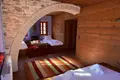 Traditional stone hotel of 320 sq.m. for sale in Central Zagori. It has 7 rooms (22 beds), café-bar, full FF&E equipment, and EOT license. Turnkey investment, €920,000