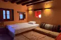 Traditional stone hotel of 320 sq.m. for sale in Central Zagori. It has 7 rooms (22 beds), café-bar, full FF&E equipment, and EOT license. Turnkey investment, €920,000