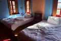 Traditional stone hotel of 320 sq.m. for sale in Central Zagori. It has 7 rooms (22 beds), café-bar, full FF&E equipment, and EOT license. Turnkey investment, €920,000