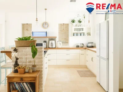 Quartier résidentiel Une exclusivité exceptionnelle : une splendide maison de plain-pied au centre-ville et au calme !