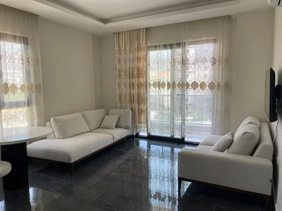 Zespół mieszkaniowy Umeblowany apartament 1+1 położony 400 metrów od morza w kompleksie Tekinoğlu.