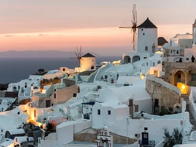 The Greek island of Santorini is a picturesque archipelago in the Aegean Sea with white houses and spectacular sunsets