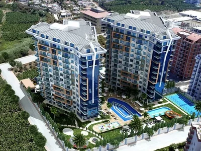 Zespół mieszkaniowy Umeblowany apartament 1+1 położony 400 metrów od morza w kompleksie Tekinoğlu.