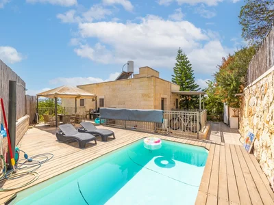 Barrio residencial Beau cottage avec piscine har gilo