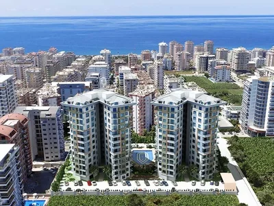 Zespół mieszkaniowy Umeblowany apartament 1+1 położony 400 metrów od morza w kompleksie Tekinoğlu.